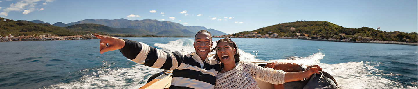 smiling couple on a boat ride on the coast, May 2024 blog, TCU,