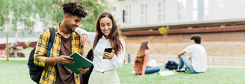 mobile banner of college students lounging outdoors in the quad grass field on campus, Aug 2023 blog, Travis CU