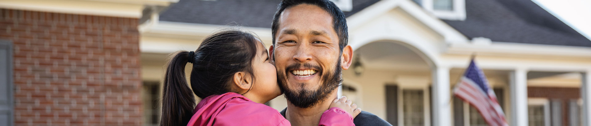 photo banner of parent and child in front of a home, home insurance, April 2023 blog, Travis CU,