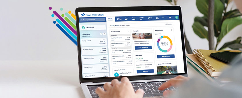 mobile view of person using laptop of new digital banking dashboard, Travis CU,