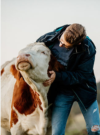 photo of student handling livestock