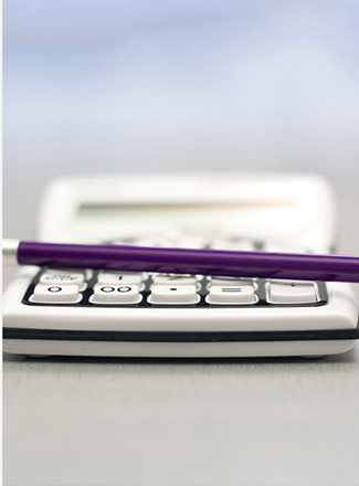 photo of calculator and pen