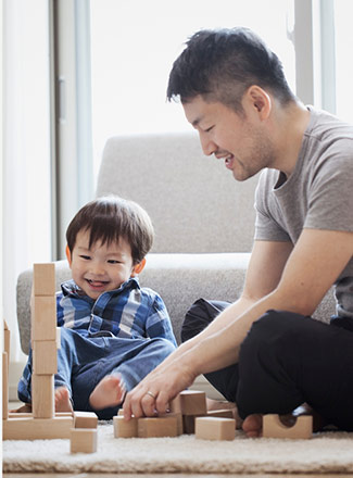 Photo of a parent and child playing with toys